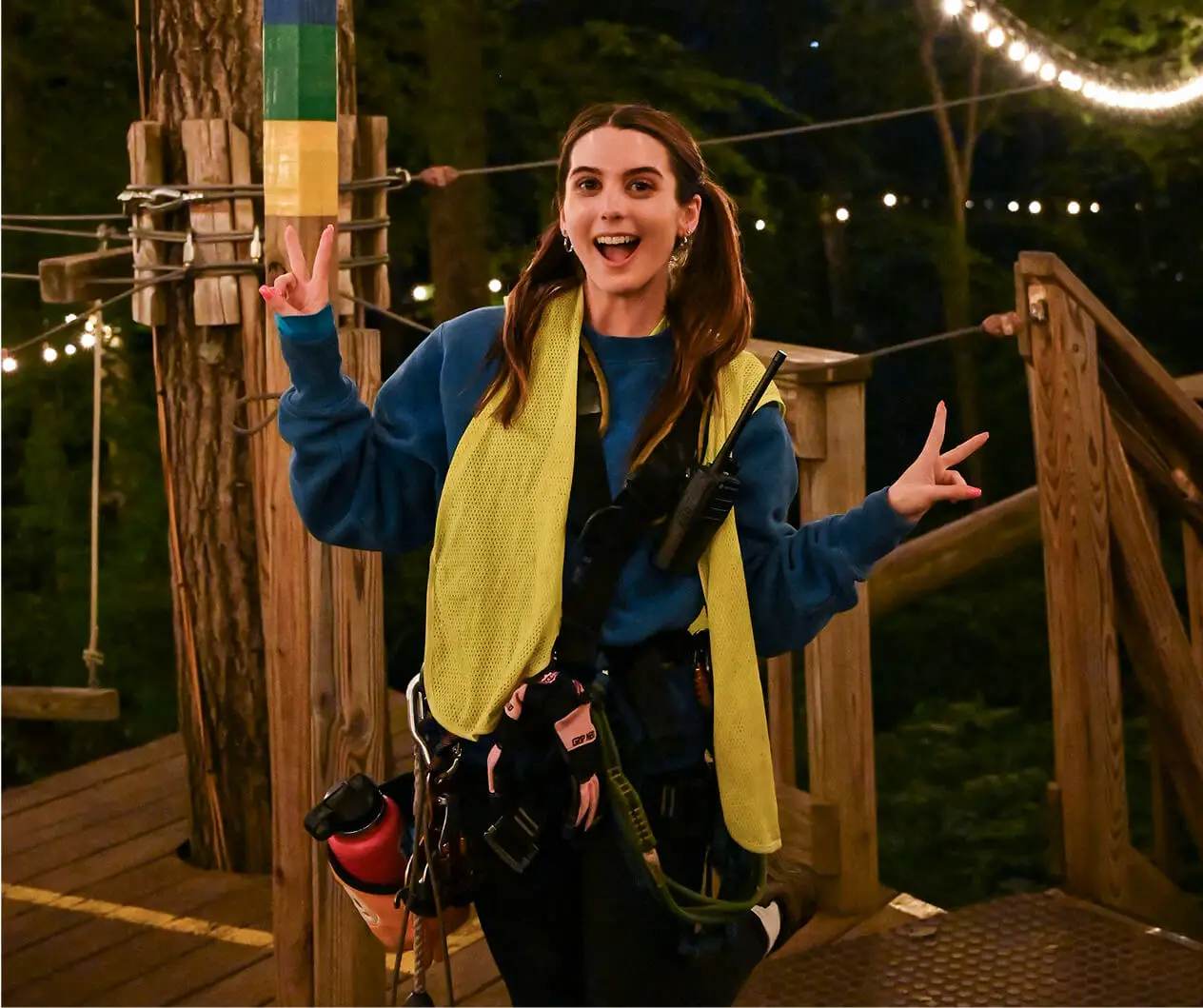 Teenage girl excitedly posing at TreEscape Park in Vernon, NJ, ready for an adventure and thrilled to experience the outdoor challenges and fun activities. Symbol of how to overcome the fear of heights