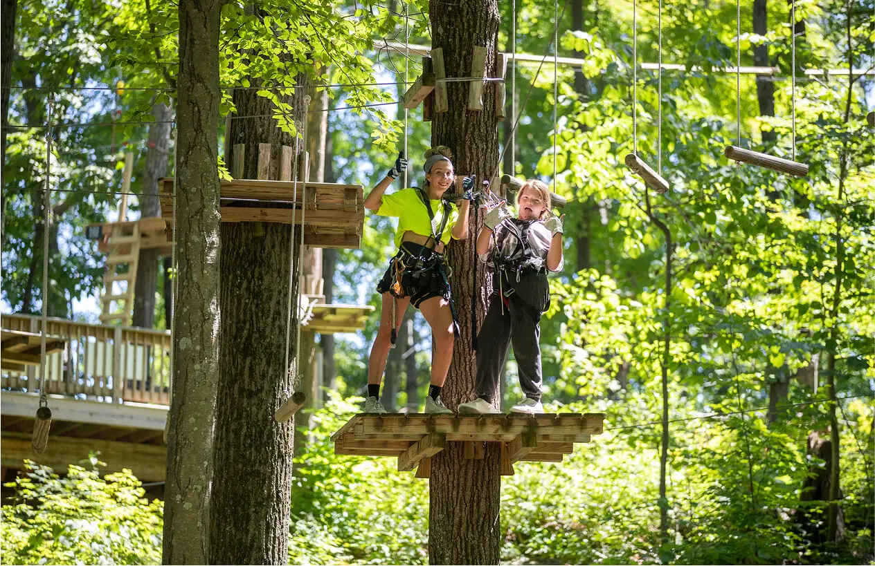 Mother and son standing together at TreEscape Park in Vernon, NJ, both excited and ready for their next adventure in the great outdoors.
