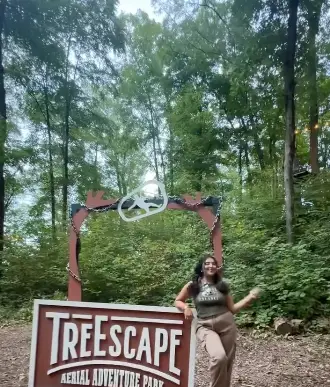 Woman influencer at TreEscape aerial adventure park in Vernon, NJ
