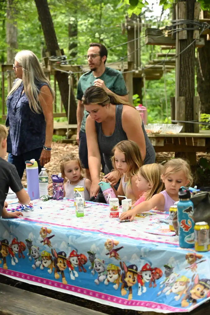Group of kids and adults having a birthday party at TreEscape adventure park, Vernon, NJ.
