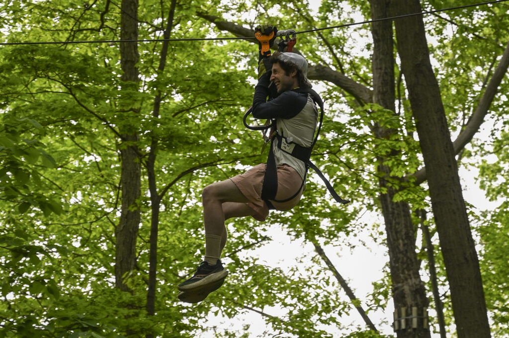 young man navigating a zip line at TreEscape NJ