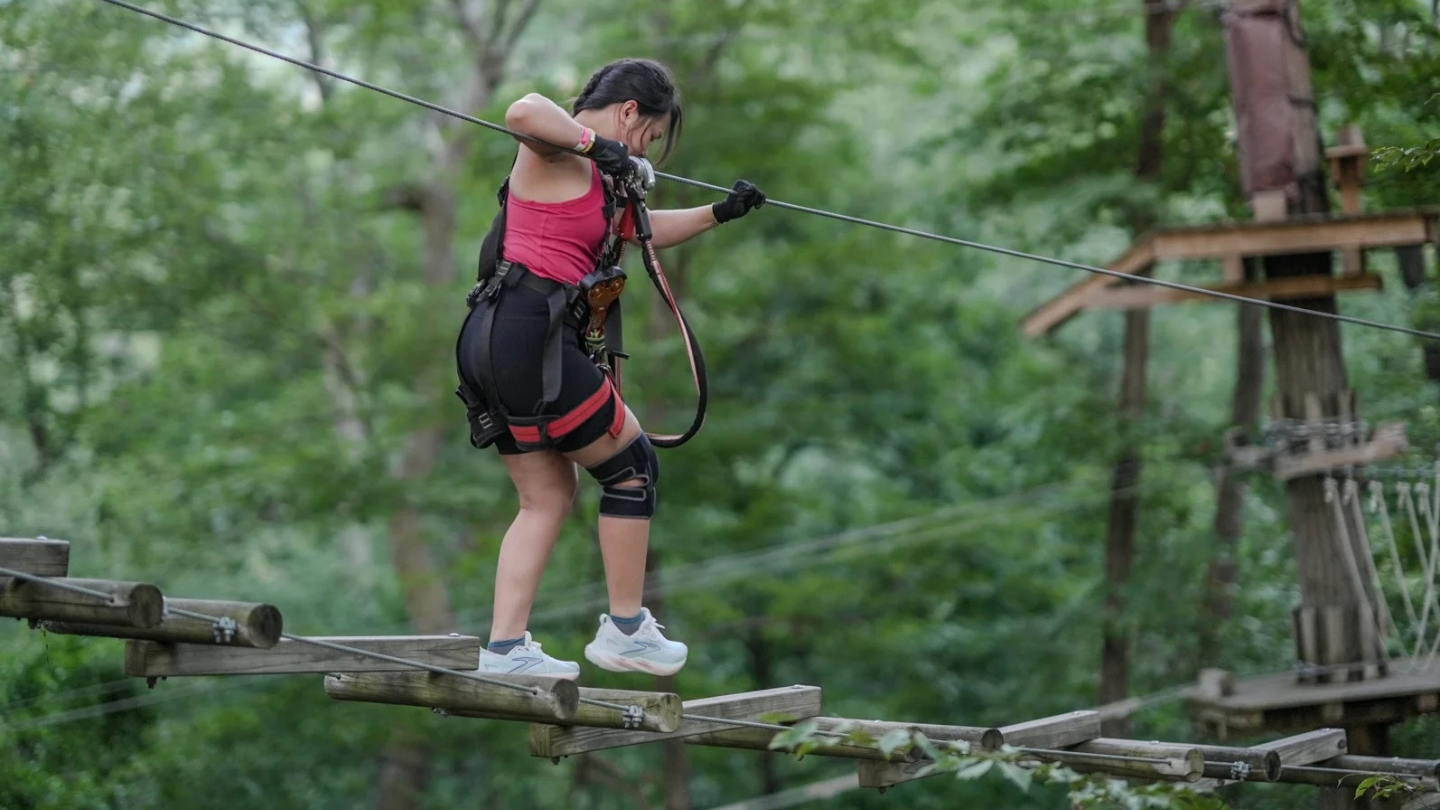 navigating teh high ropes course at TreEscape